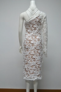Detail of white lace one-shoulder dress showing the floral patterns and the back design