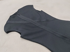 Close-up of the black bandage dress back featuring a seamless zipper and elastic fabric