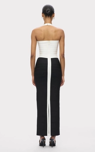Rear view of sleek black and white bodycon bandage dress with center back zipper detail