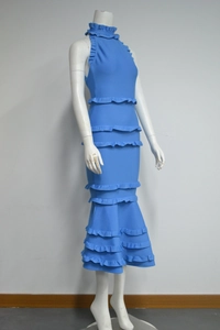 Detail of blue backless bandage dress showing multi-layered ruffles and fishtail hem