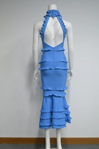 Detail of royal blue bandage dress featuring multi-layered ruffles and open back design