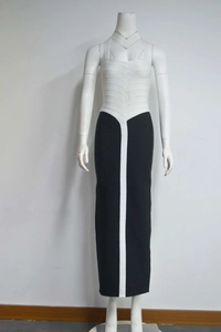 Detail of elegant black and white bandage dress with halter neck and contrast vertical stripe