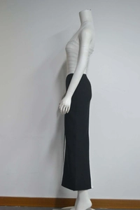 Detail view of the black and white color-block bandage dress with side stripe stitching