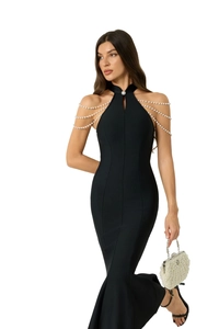 Close-up of elegant black bandage dress with luxury triple-layer pearl chain shoulders