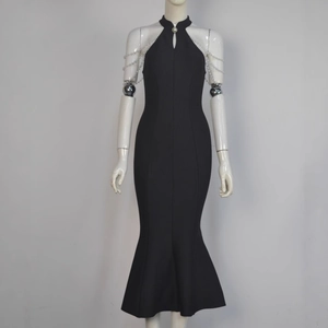 Detailed view of black mermaid dress with elegant pearl chain straps and halter neckline