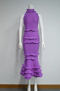 Detailed view of purple halter neck dress featuring layered ruffles and mermaid hem