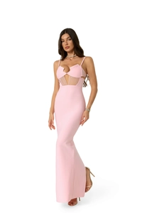 Detail of pink deep V-neck evening dress with geometric mesh cutouts and slim silhouette