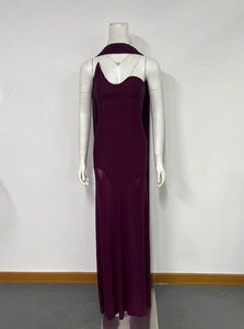 Detail of the elegant burgundy one-shoulder bodice and mesh patchwork evening gown