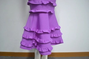 Detailed view of multilayered purple ruffled hem for professional latin dance dress