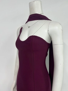 Close-up of wine red ribbed knit bodycon dress featuring elegant neck wrap and tube top detail