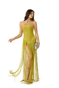 Detail of elegant mustard green tube dress featuring long fringe and sequin sandals