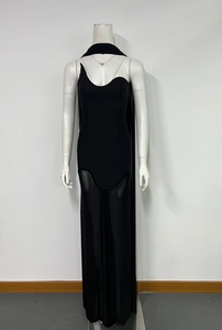 Detail of a black strapless bandage dress with sheer mesh paneling and a choker neck strap