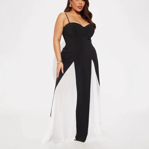 Detail of contrast chiffon patchwork on the bodice of a slimming black and white maxi dress