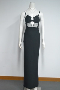 Detail of black evening dress with sheer mesh waist cutout and bow chest design