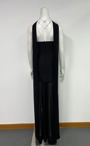 Detail of black evening gown featuring elegant long cape straps and back zipper closure