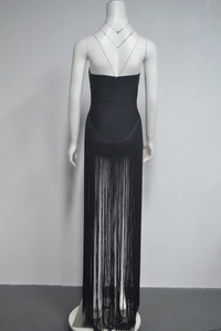 Detailed back view of a black bandage dress with elegant long fringe layers and a hidden zipper