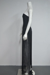 Detailed side view of black tube dress featuring high-density long fringe tassels on mannequin