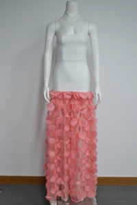 Detail of pink 3D floral applique on tulle skirt paired with white strapless top