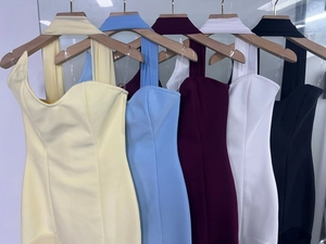 Detail showing various colors of sweetheart neckline tube dresses on wooden hangers