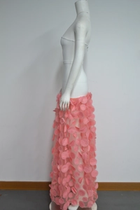 Detail of pink strapless ball gown showing high waist and 3D floral petals texture