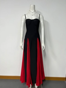 Detailed shot of two-tone contrast evening dress featuring red chiffon patchwork hemline
