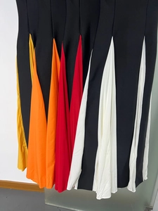 Detail of color-blocked pleated chiffon inserts on slim-fit elegant bandage dresses
