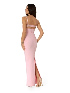 Pink bodycon maxi dress with back cutout and high slit shown from a full-body rear view
