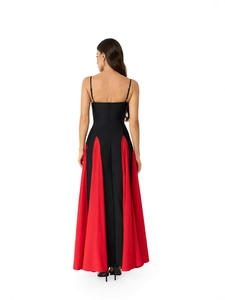 Elegant back view of black and red slim fit floor-length evening gown with godet hem