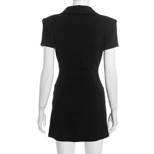 Detail view of the back of a slim fit black V-neck mini dress with elegant tailoring