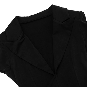 Close-up of black dress with deep V-neckline and notched lapel collar detail