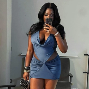 Detail of navy blue sleeveless dress with deep V-neck, waist cut-outs and ruched design