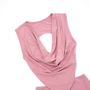 Close-up of dark pink deep V-neck dress featuring a draped neckline and circular cutout detail