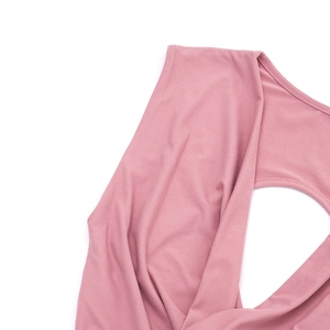 Close-up of the elegant deep V-neckline and textured draping on this rose pink dress