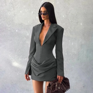 Close-up of deep V-neckline and corset-style hook closure on slim fit blazer dress