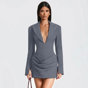 Detailed view of the elegant hook-and-eye closure and draped pleats on this grey blazer dress