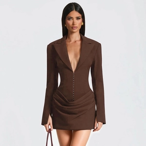 Detailed view of the gathered waist and button closure on dark brown mini blazer dress