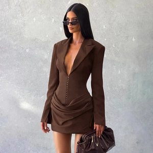 Detail of dark brown corset blazer dress with deep V-neck and draped skirt design