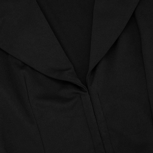 Detail of elegant black deep V-neck blazer dress with refined lapel and stitched texture