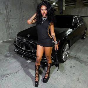 Sexy black sleeveless mini dress featuring side cutouts and metal eyelet ring details