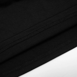 Detailed macro view of black fabric with precise double-needle stitching and clean edges