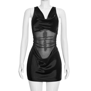 Detail of sheer mesh paneling and ruched texture on sexy black slim fit mini dress