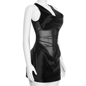 Detailed side view of black mini dress featuring satin panels and sheer mesh inserts