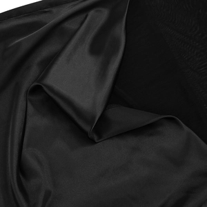 Close-up of premium black satin fabric with smooth texture and elegant light reflections