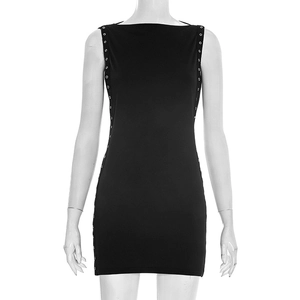 Detail of black bodycon dress featuring vertical metal eyelet decorations along the side