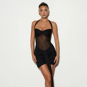 Detail of black halter neck dress with mesh patchwork, twist knot, and long ribbon ties