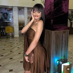 Detailed view of dark brown satin halter dress with elegant draping and backless design