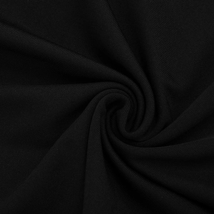Macro detail of high-quality black ribbed fabric showing fine vertical texture and elasticity