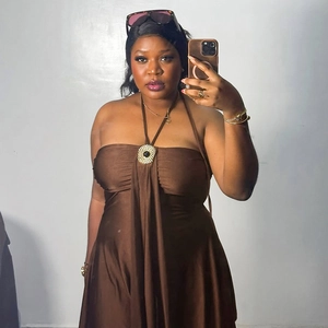 Elegant brown halter neck mini dress featuring a central metallic circular buckle detail