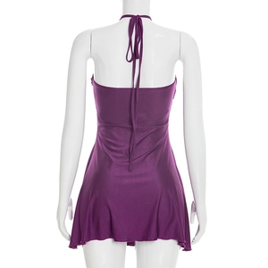Detail view of purple satin halter neck mini dress with backless tie-up design