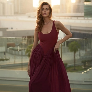 Detail of burgundy long dress with pleated chiffon skirt and slim fit sleeveless bodice